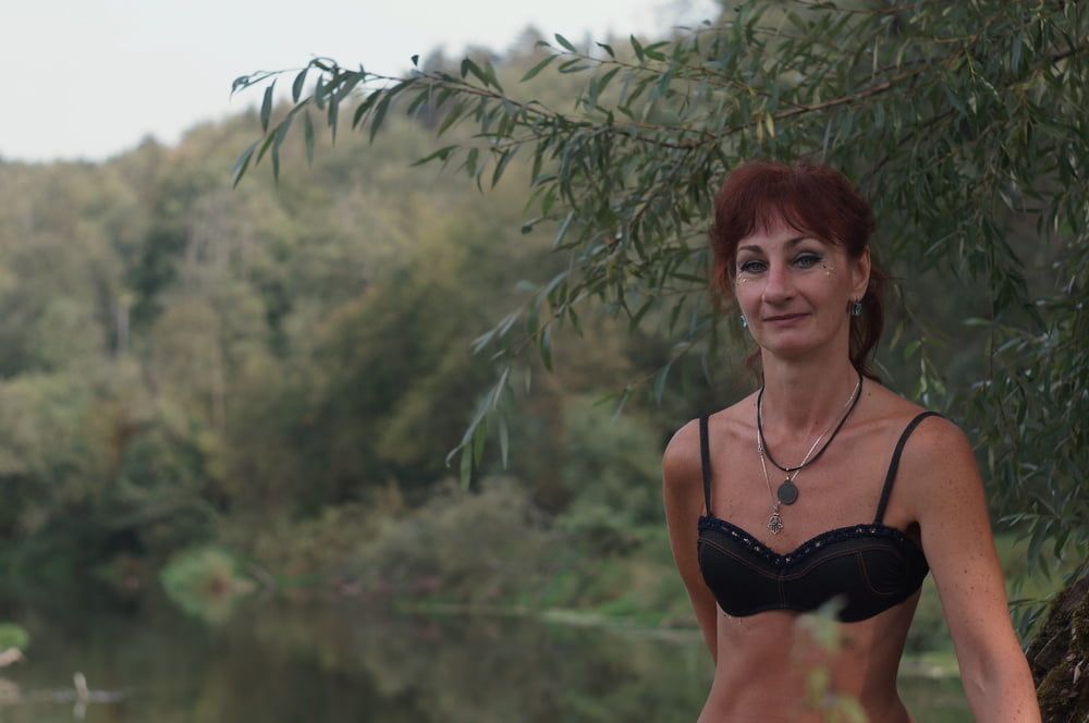 Black bikini near tree upon river #10