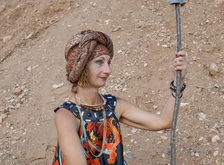 with spear wearing in colorful dress         