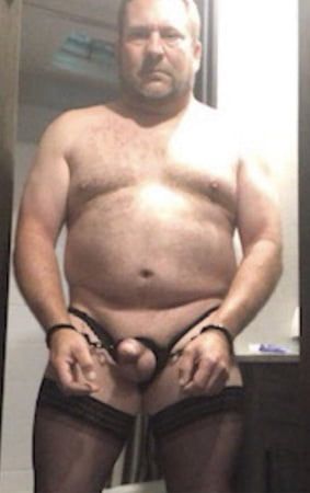 Brandon Hegsted wearing thigh highs, panties and handcuffs