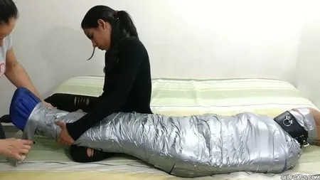 sexy girl trapped in ultra tight layered mummification         