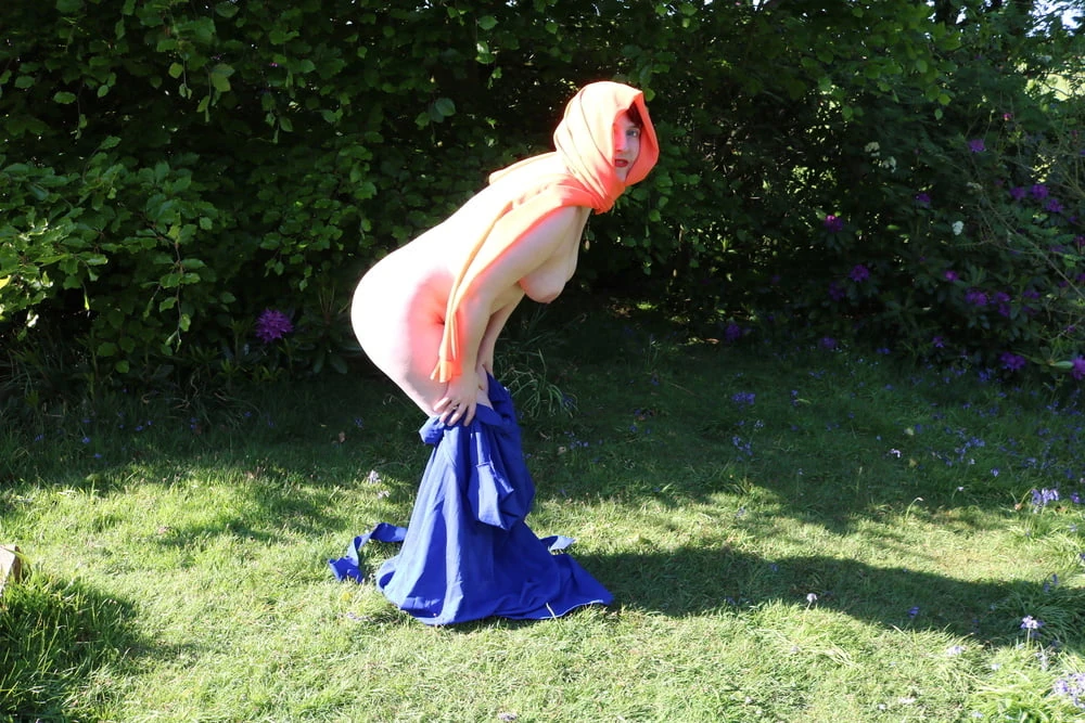 hijab and abaya flashing outdoors #44