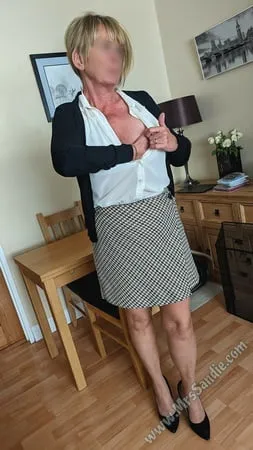 ready for work in skirt blouse pantyhose and heels         