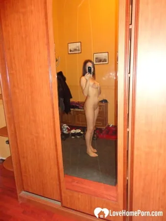 Hot teen shows her body in the mirror         