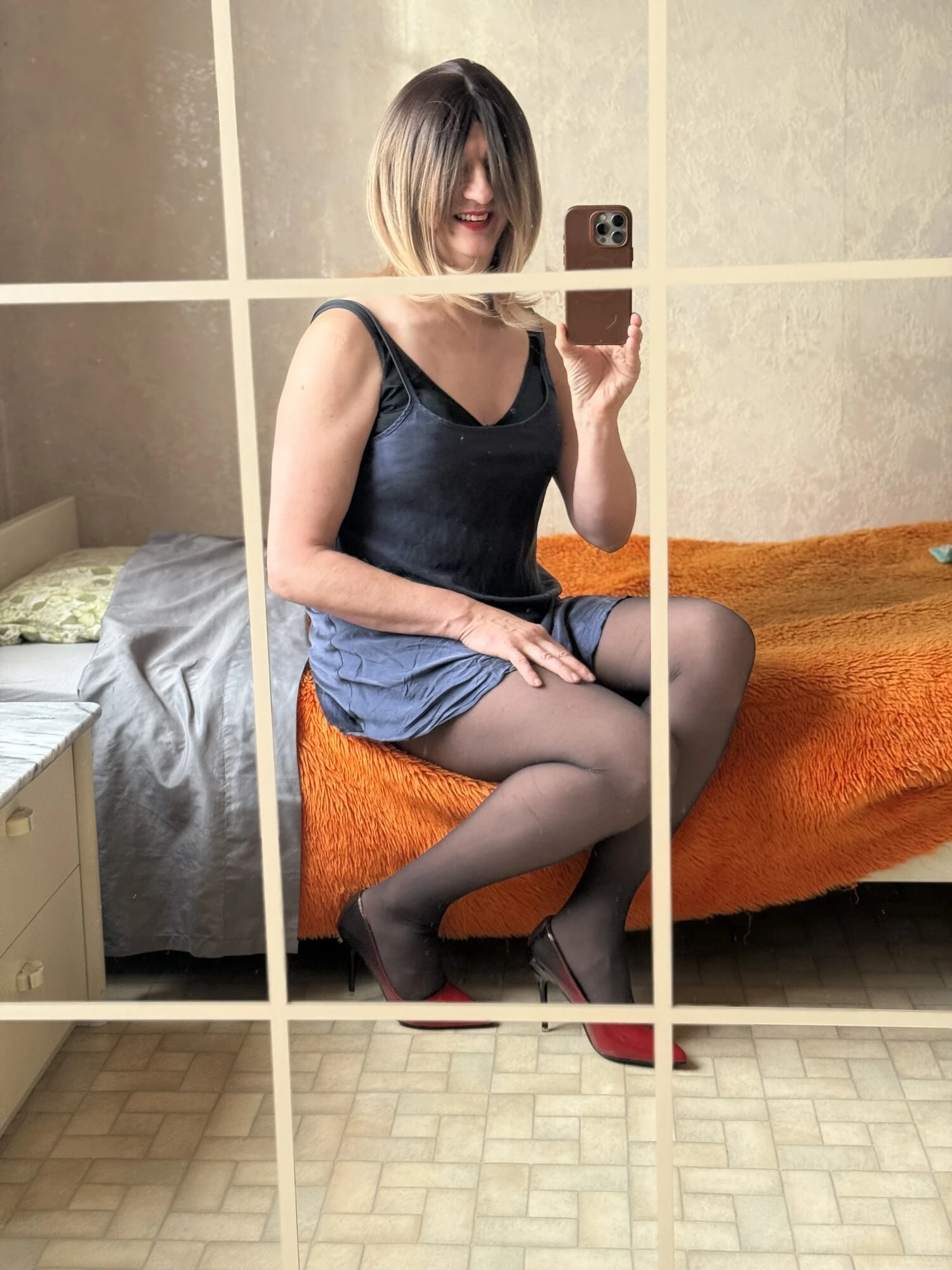 Evy finally as a blonde wearing a short blue nightgown