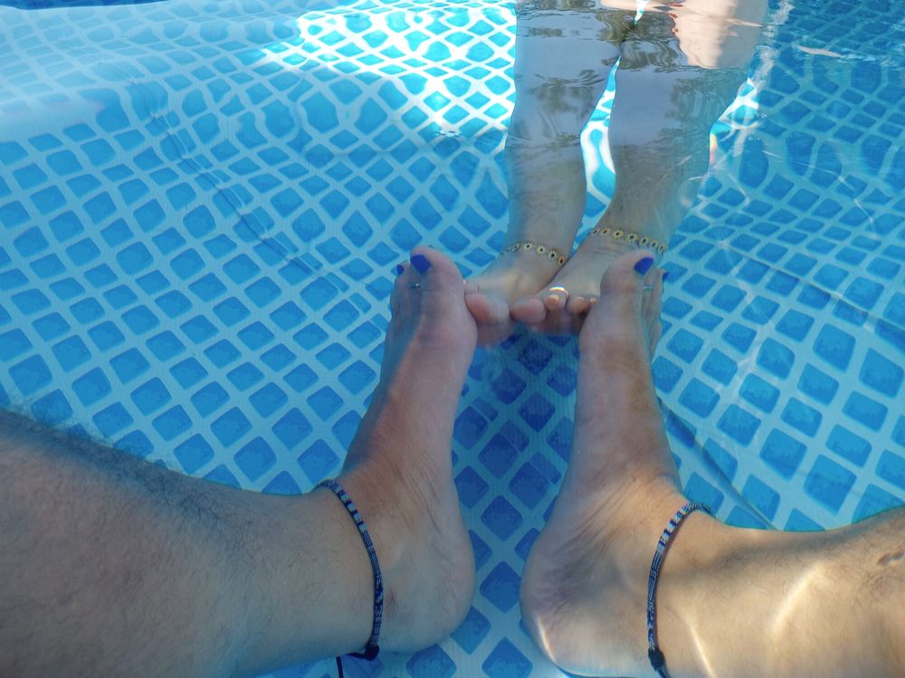 Showing off our pedicures in the pool #20