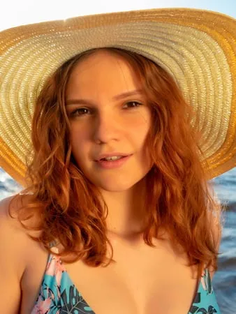 beach relaxation with a young redhead girl verlonis         