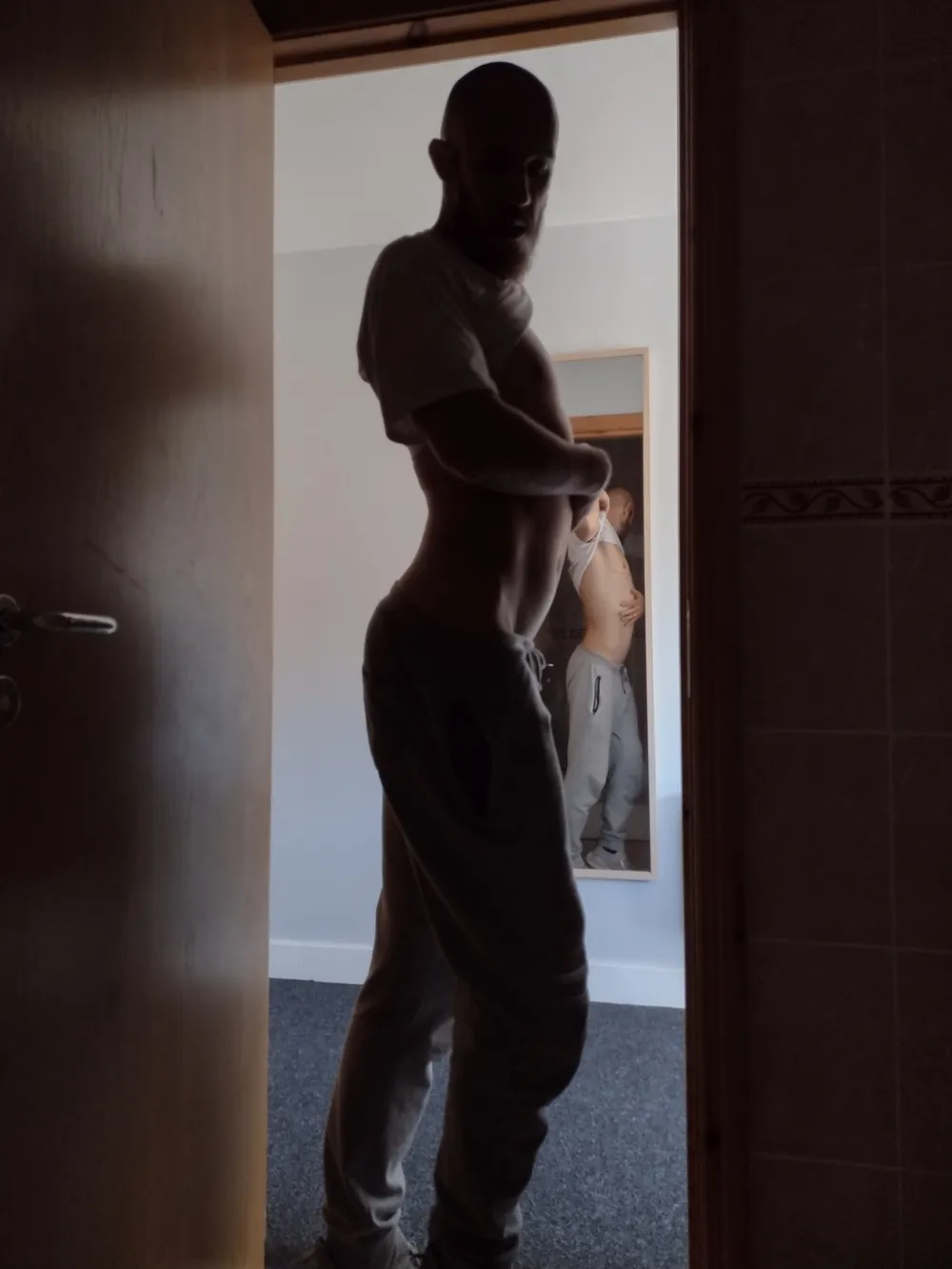 Posing nude in doorway #3