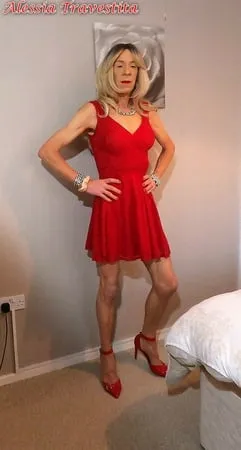    alessia travestita in flirty red dress         