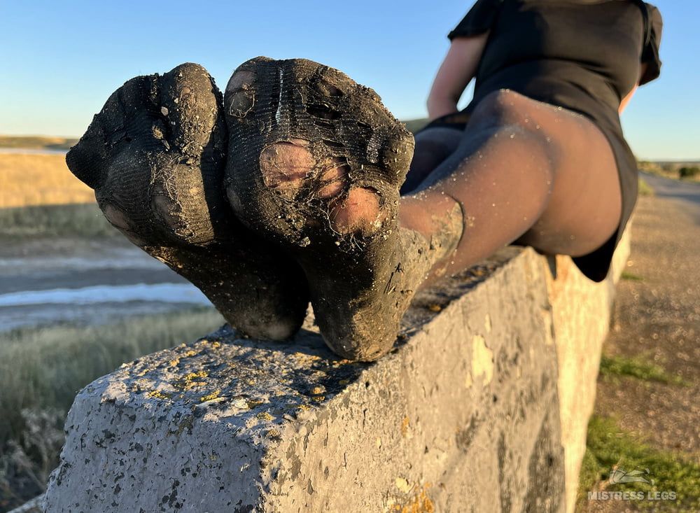 Torn and dirty feet in pantyhose outdoor #4