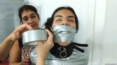 heavily duct tape mummified by crazy bondage women         