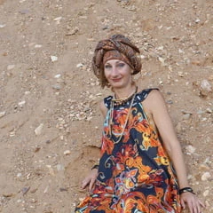 With spear wearing in colorful dress