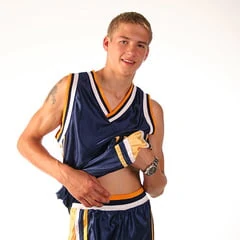 Blond teenage Latvian hunk poses in his basketball uniform