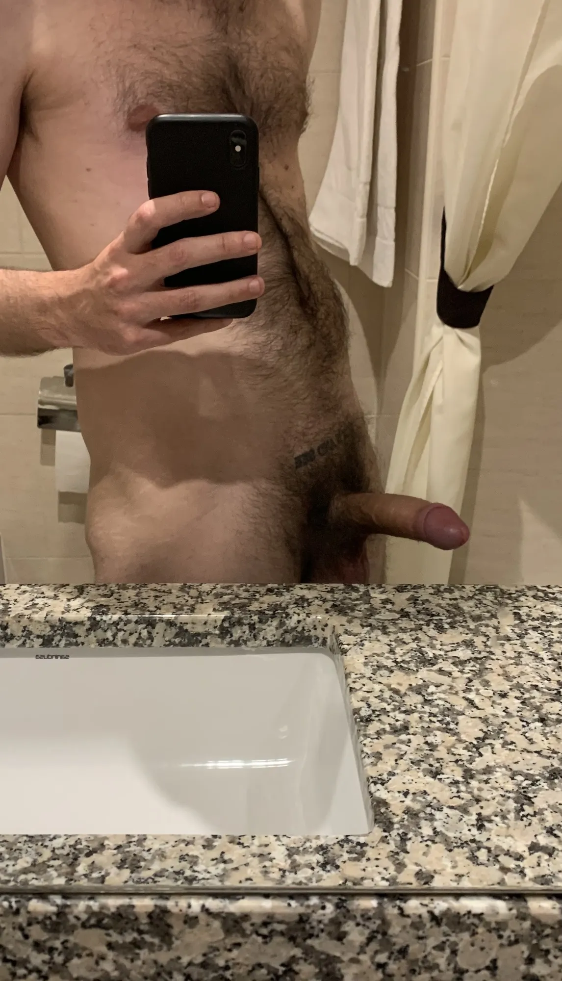 Naked in the hotel bathroom