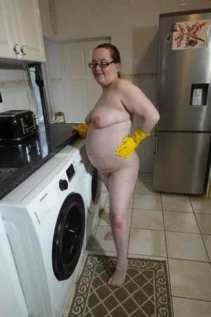 naked cleaning in rubber gloves         