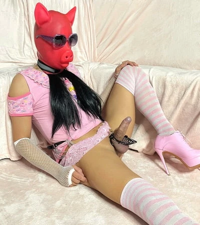 sissy wearing a pink dress heels and chastity cage pt           