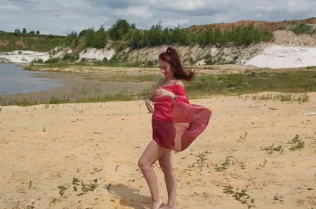 red shawl on white sand         