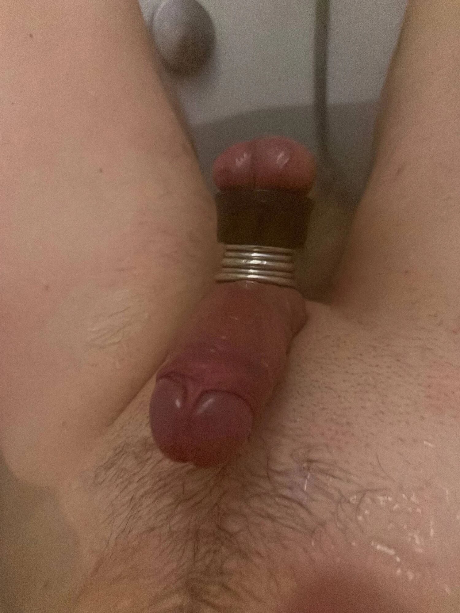 The guy has a small penis and balls hanging down to his knee