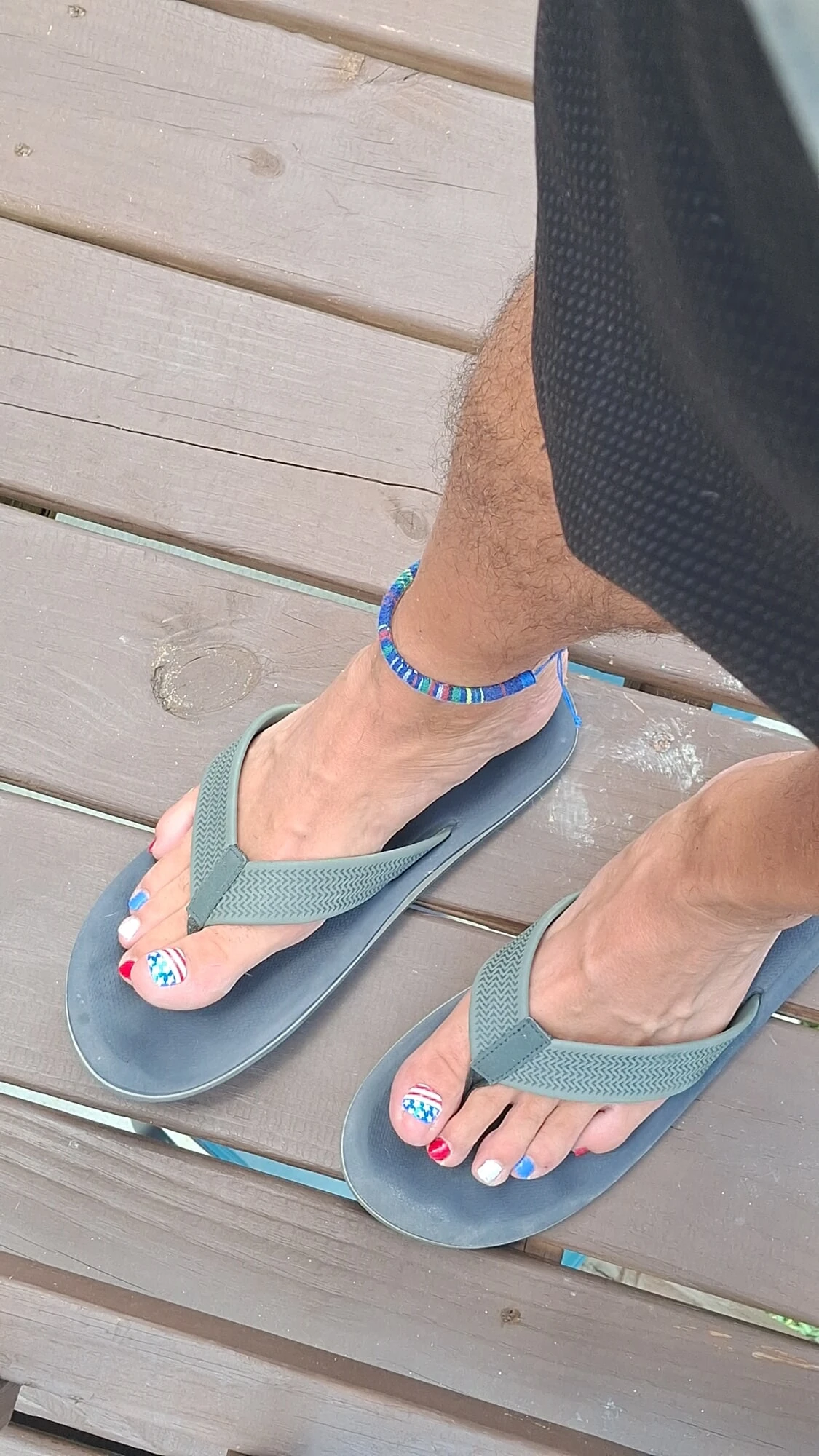 My feet in flip flop sandals