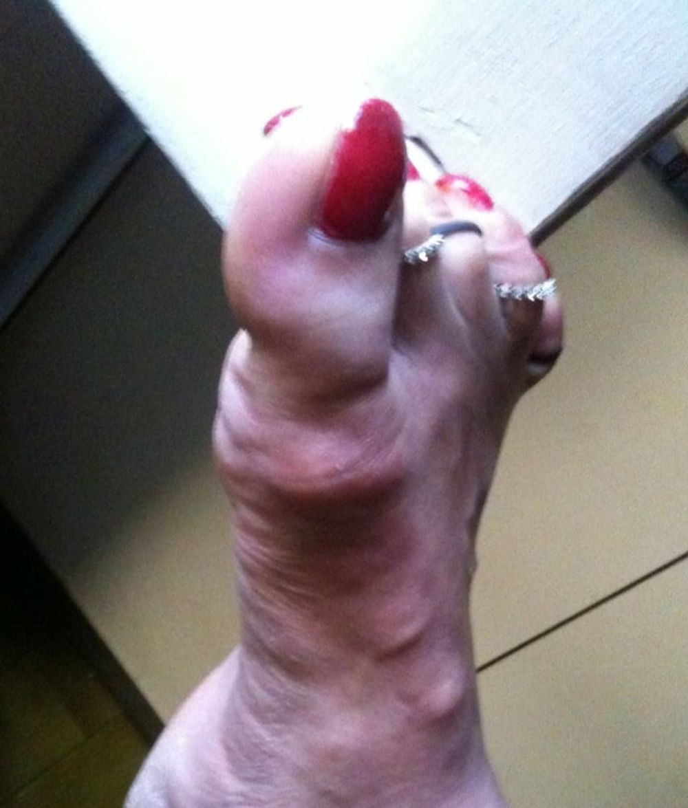 red toenails mix (older, dirty, toe ring, sandals mixed).