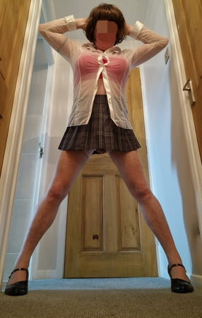 Cross Dressing Schoolgirl in Tartan Skirt & 10 Suspenders