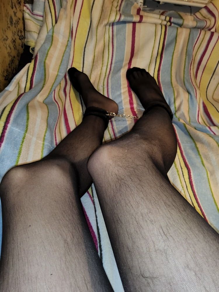 Me in black pantyhose and cuffs
