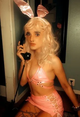 pink bunny talking on the phone while showing off pussy         