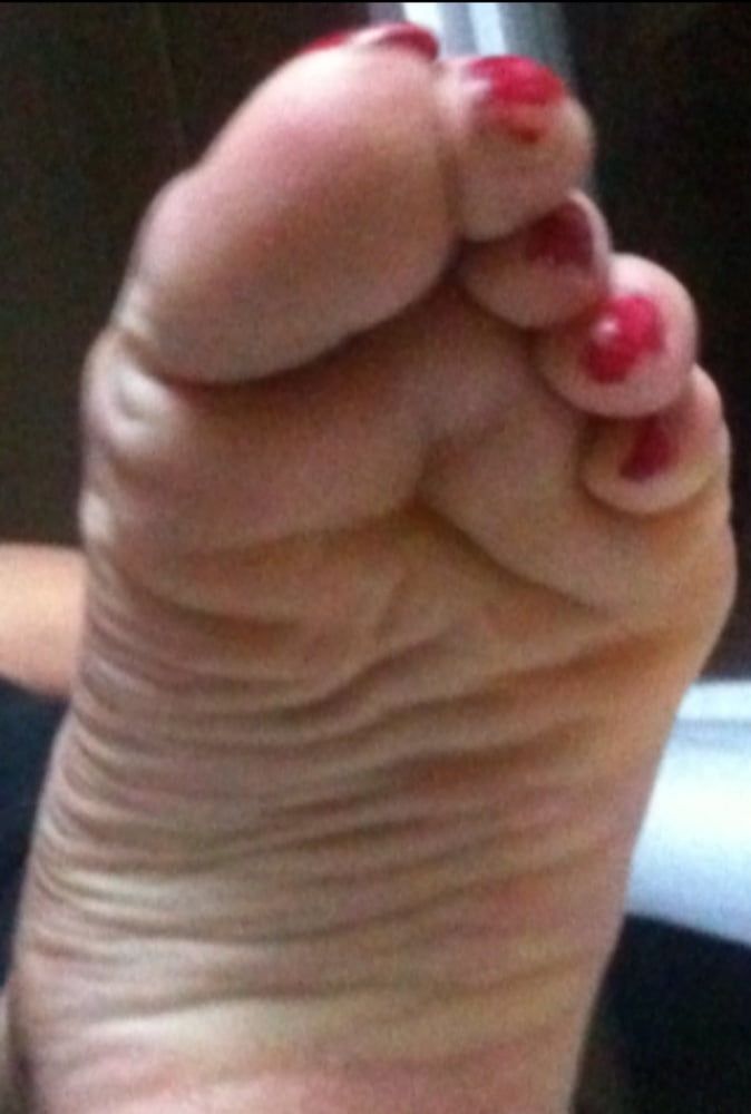 used red toenails, and soles feet after day at beach #12