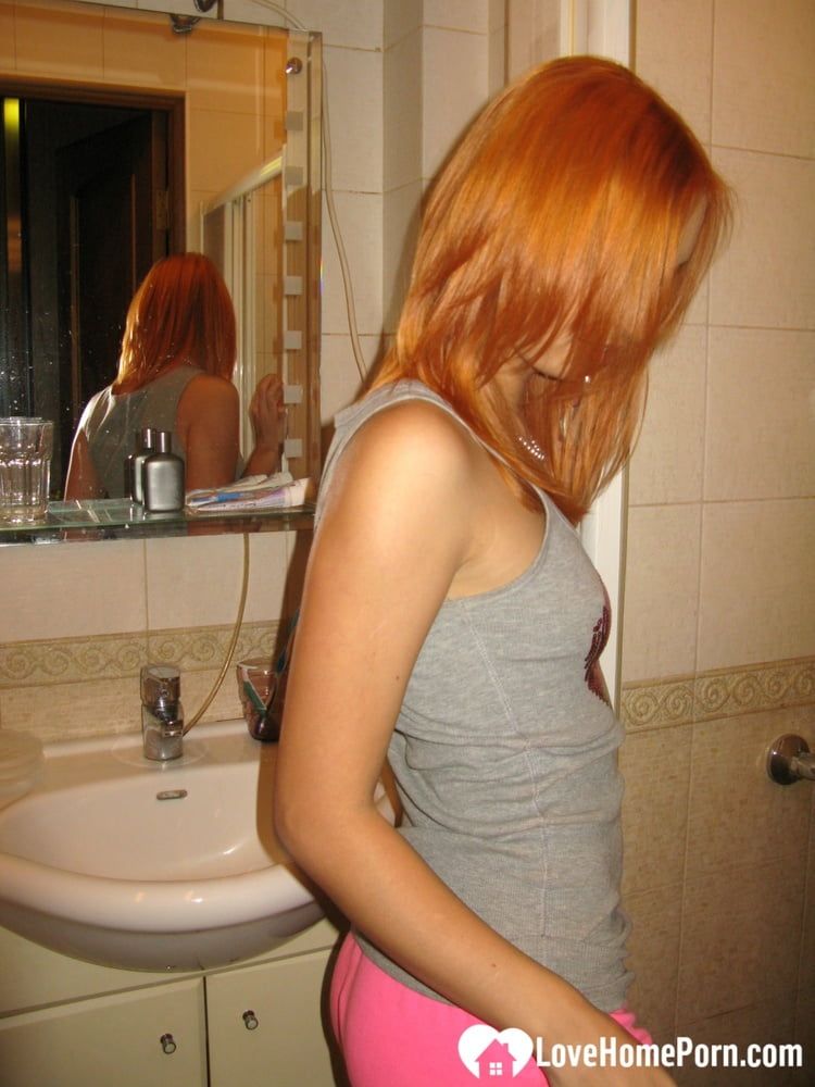 Redhead taking some hot selfies before showering #14