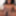 Black sweetheart Dakota Simone lifts her sweater to bare her breasts