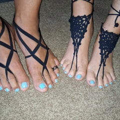 Playing footsie together with matching barefoot sandals 
