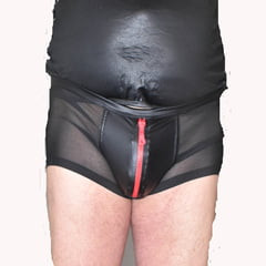 DRESSED IN A TIGHT NYLON SHORTS.