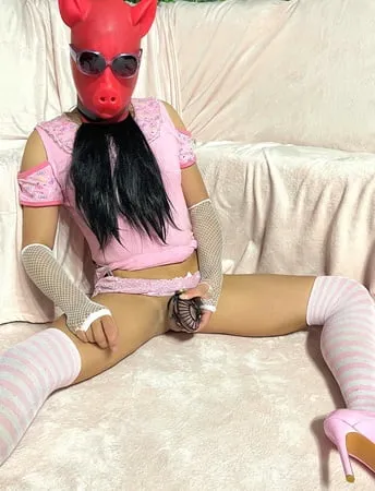 sissy wearing a pink dress heels and chastity cage pt           