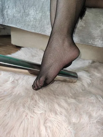 bare feet and fishnet feet heels         