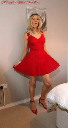    alessia travestita in flirty red dress         