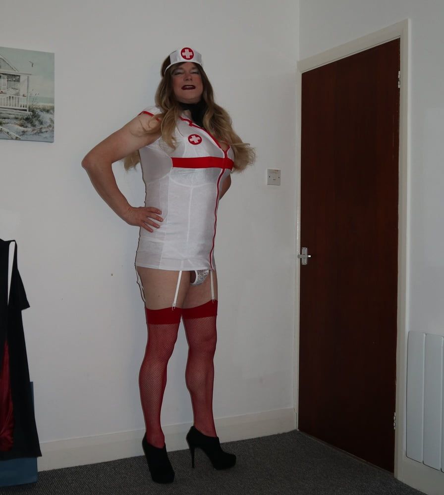 slutty looking nurse in red fishnet stockings