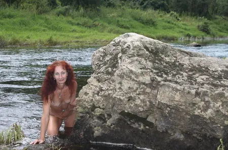 near a boulder in the river         