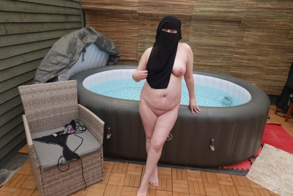 wife showing off big breasts and ass in Niqab #6