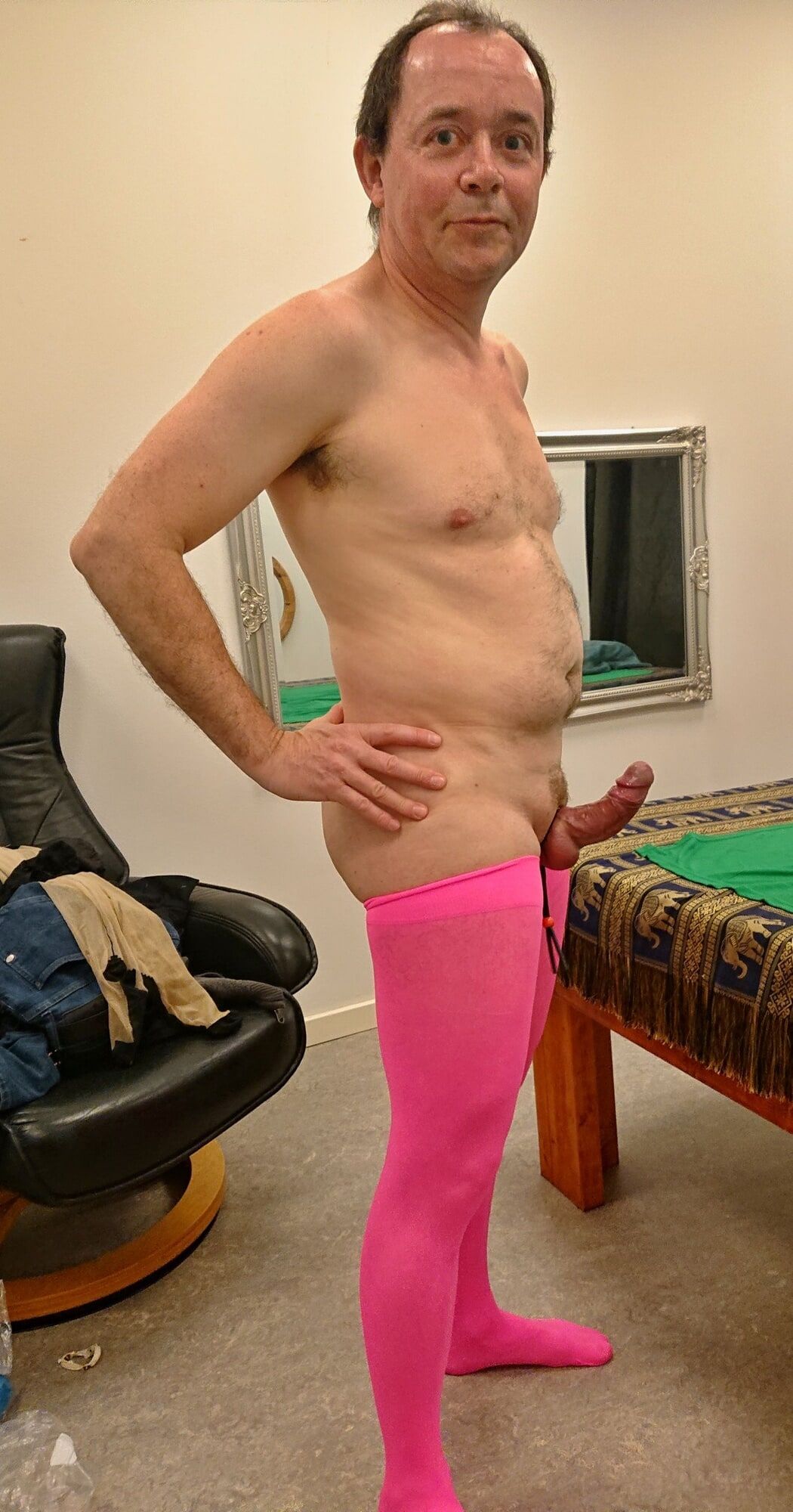 Crossdresser shows his stiff cock in sexy pink stockings #4