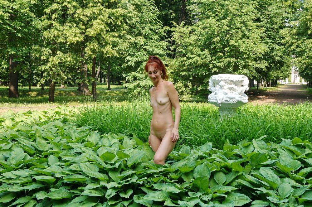 Naked in the grass by the vase #3