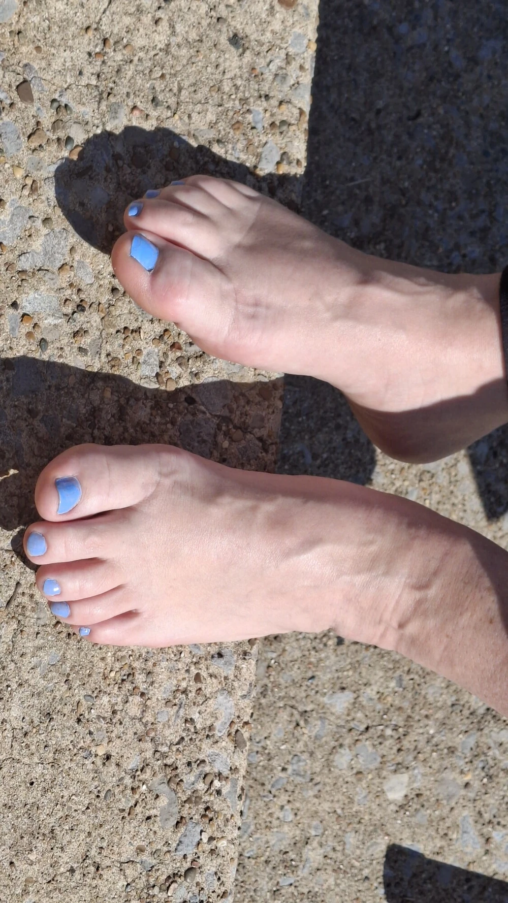 Relaxing outside showing our pedicured and painted toes #2