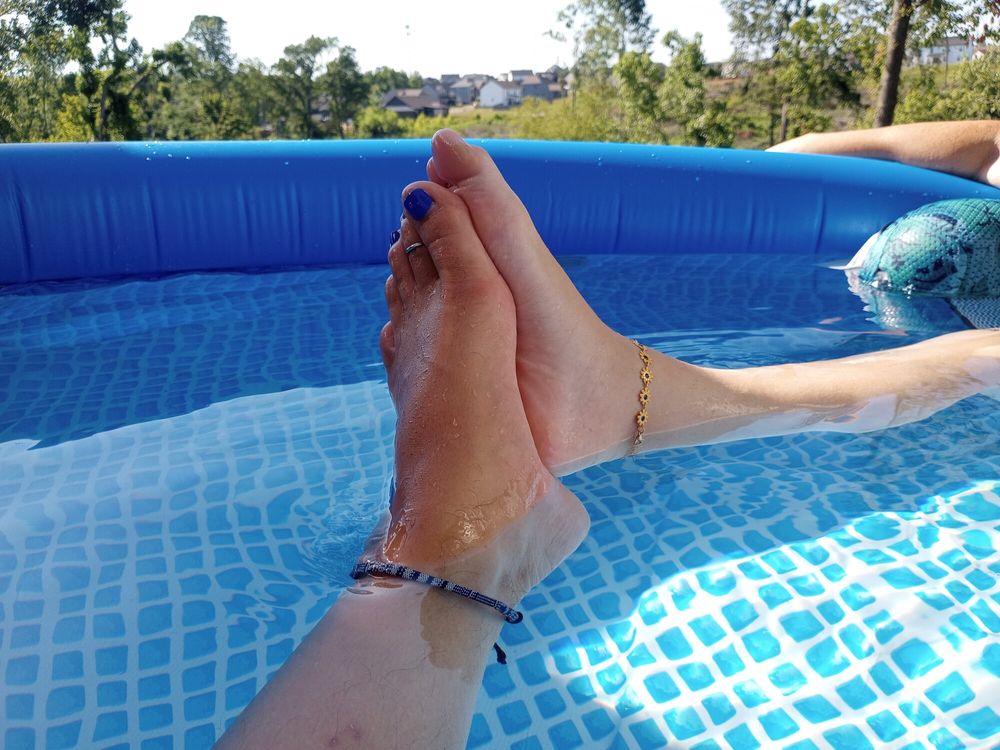 Showing off our pedicures in the pool #24