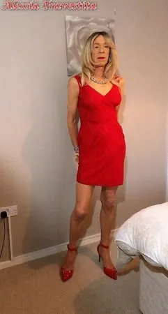    alessia travestita in flirty red dress         