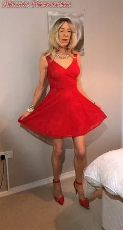    alessia travestita in flirty red dress         