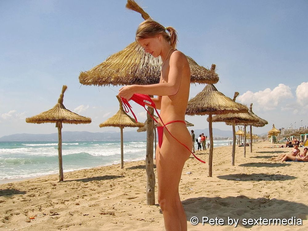 Blonde Petty pissing on the beach #27