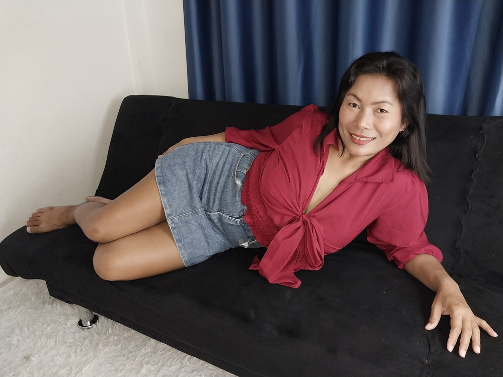 Thaiger on the Sofa in a Mini Skirt and a Red Top #9