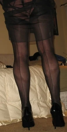 long luscious legs encased in sheer black silk ff nylons         