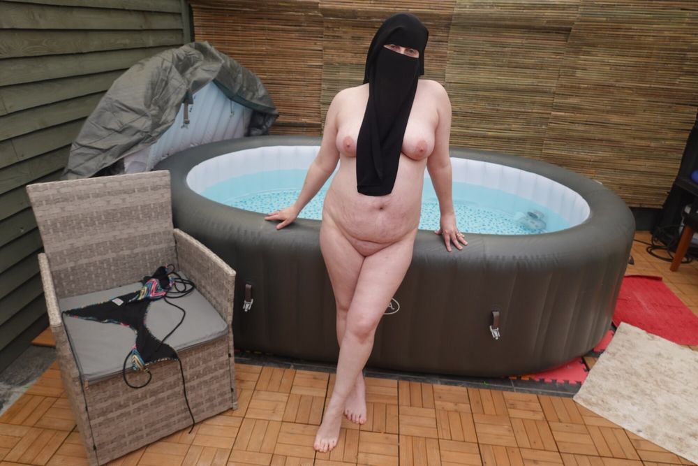 wife showing off big breasts and ass in Niqab #7