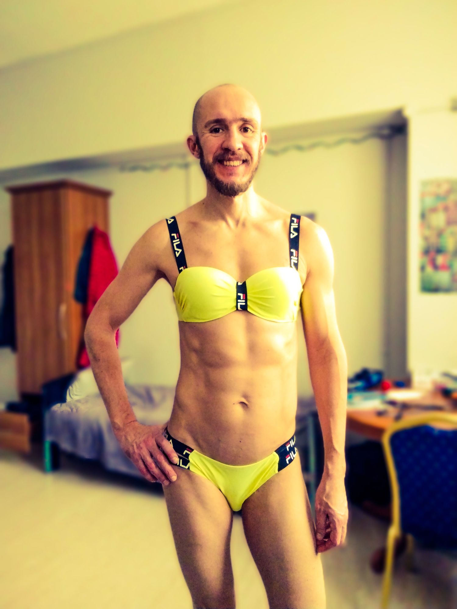 Bearded athletic man posing in yellow swimsuit  #4