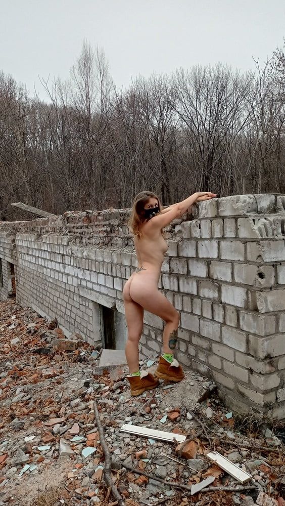 Sexy teen undressed near ruined house