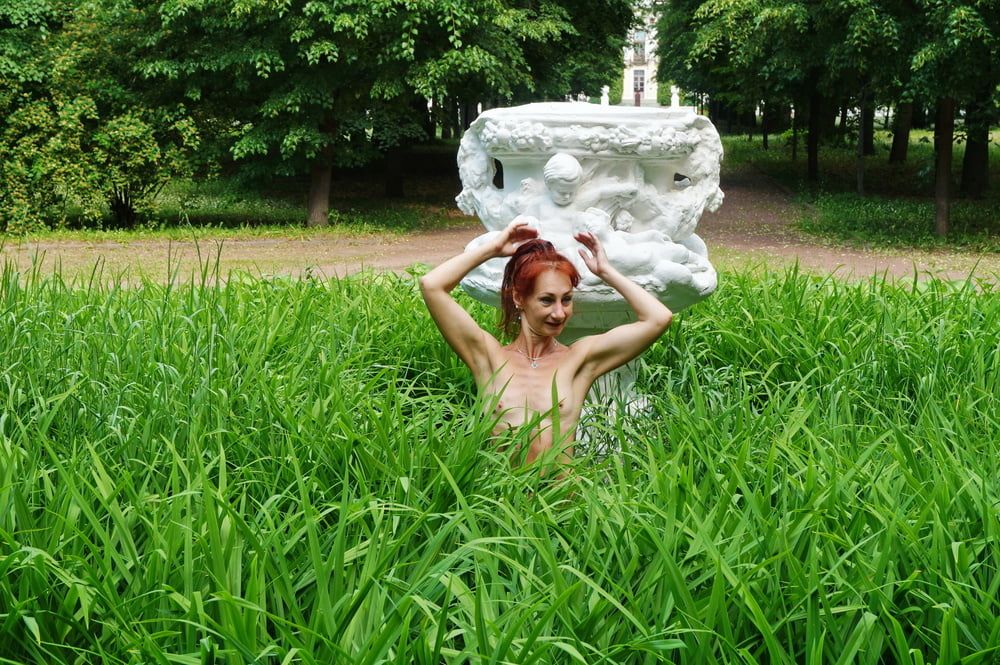 Naked in the grass by the vase #47